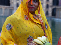 A Hindu devotee performs rituals of the 'Chhath Puja' festival at the Shrine Galta Ji temple Kund in Jaipur, Rajasthan, India, on November 7...