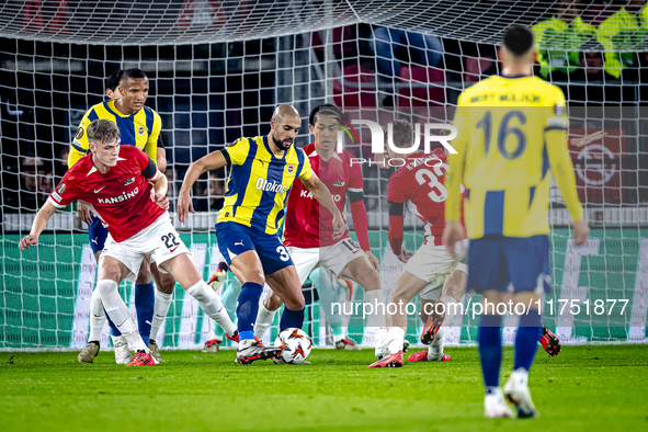 AZ Alkmaar defender Maxim Dekker and Fenerbahce midfielder Sofyan Amrabat play during the match between AZ and Fenerbahce at the AFAS stadiu...