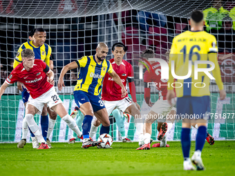 AZ Alkmaar defender Maxim Dekker and Fenerbahce midfielder Sofyan Amrabat play during the match between AZ and Fenerbahce at the AFAS stadiu...