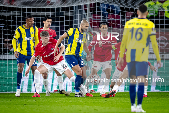 AZ Alkmaar defender Maxim Dekker and Fenerbahce midfielder Sofyan Amrabat play during the match between AZ and Fenerbahce at the AFAS stadiu...