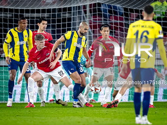 AZ Alkmaar defender Maxim Dekker and Fenerbahce midfielder Sofyan Amrabat play during the match between AZ and Fenerbahce at the AFAS stadiu...