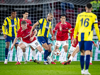 AZ Alkmaar defender Maxim Dekker and Fenerbahce midfielder Sofyan Amrabat play during the match between AZ and Fenerbahce at the AFAS stadiu...