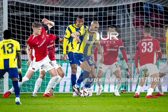 AZ Alkmaar defender Maxim Dekker and Fenerbahce midfielder Sofyan Amrabat play during the match between AZ and Fenerbahce at the AFAS stadiu...