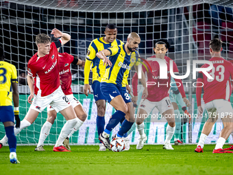 AZ Alkmaar defender Maxim Dekker and Fenerbahce midfielder Sofyan Amrabat play during the match between AZ and Fenerbahce at the AFAS stadiu...