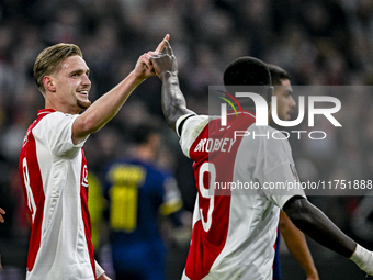 AFC Ajax Amsterdam midfielder Kenneth Taylor and AFC Ajax Amsterdam forward Brian Brobbey celebrate the 2-0 goal during the match between Aj...