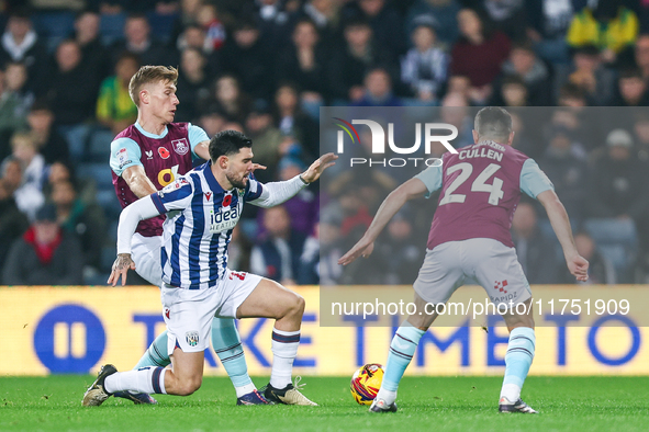 Number 27, Alex Mowatt of WBA, is in defensive action during the Sky Bet Championship match between West Bromwich Albion and Burnley at The...