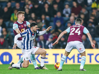 Number 27, Alex Mowatt of WBA, is in defensive action during the Sky Bet Championship match between West Bromwich Albion and Burnley at The...