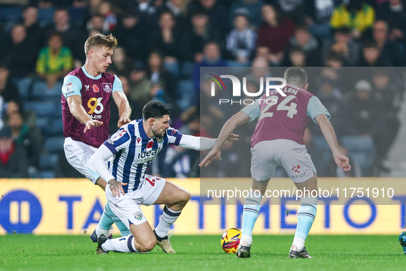 Number 27, Alex Mowatt of WBA, is in defensive action during the Sky Bet Championship match between West Bromwich Albion and Burnley at The...