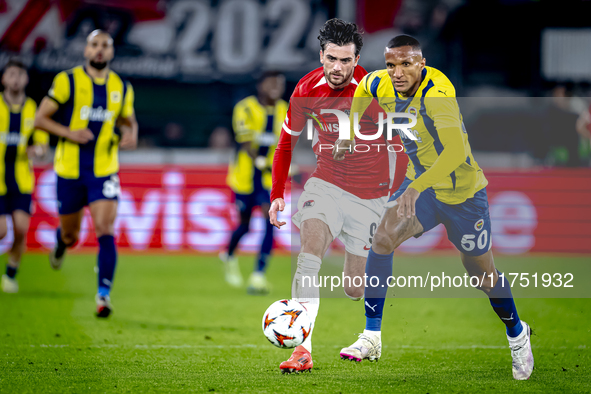 Fenerbahce defender Rodrigo Becao and AZ Alkmaar forward Troy Parrot play during the match between AZ and Fenerbahce at the AFAS Stadium for...