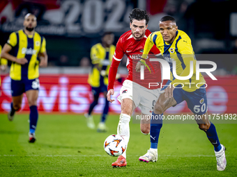 Fenerbahce defender Rodrigo Becao and AZ Alkmaar forward Troy Parrot play during the match between AZ and Fenerbahce at the AFAS Stadium for...