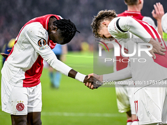 AFC Ajax Amsterdam forwards Bertrand Traore and Mika Godts celebrate the 3-0 goal during the match between Ajax and Maccabi Tel Aviv at the...