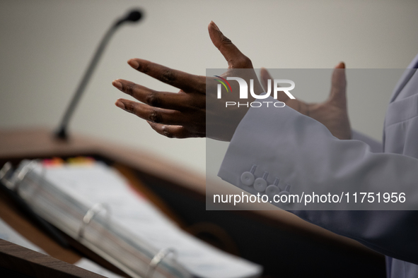 Press Secretary Karine Jean-Pierre gestures while she answers a question while her notebook sits on the lectern during the daily White House...