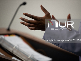 Press Secretary Karine Jean-Pierre gestures while she answers a question while her notebook sits on the lectern during the daily White House...