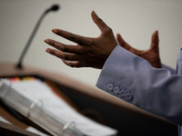 Press Secretary Karine Jean-Pierre gestures while she answers a question while her notebook sits on the lectern during the daily White House...