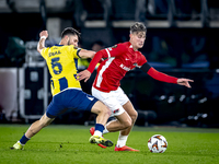 Fenerbahce midfielder Ismail Yusek and AZ Alkmaar midfielder Dave Kwakman play during the match AZ - Fenerbahce at the AFAS stadium for the...