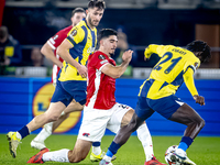 AZ Alkmaar forward Mayckel Lahdo and Fenerbahce forward Bright Osayi-Samuel play during the match between AZ and Fenerbahce at the AFAS Stad...