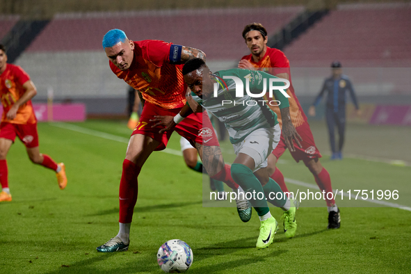 Kemar Reid of Floriana is closely followed by Alessandro Coppola of Birkirkara during the Malta 360 Sports Premier League soccer match betwe...