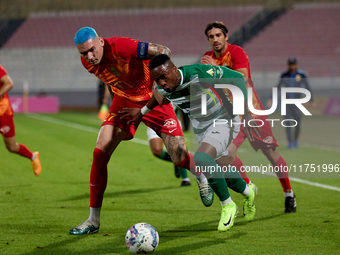 Kemar Reid of Floriana is closely followed by Alessandro Coppola of Birkirkara during the Malta 360 Sports Premier League soccer match betwe...