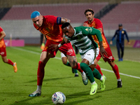 Kemar Reid of Floriana is closely followed by Alessandro Coppola of Birkirkara during the Malta 360 Sports Premier League soccer match betwe...