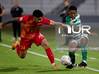 Thiago Dos Santos Nascimento of Floriana is closely followed by Leandro Lautaro Lacunza of Birkirkara during the Malta 360 Sports Premier Le...