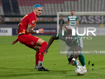 In Ta' Qali, Malta, on November 7, 2024, Franklin Sasere of Floriana moves away with the ball ahead of Alessandro Coppola of Birkirkara duri...