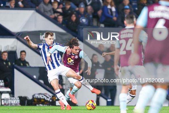 #8, Jayson Molumby of WBA and #30, Luca Koleosho of Burnley battle for possession during the Sky Bet Championship match between West Bromwic...