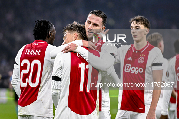 AFC Ajax Amsterdam forward Mika Godts and AFC Ajax Amsterdam midfielder Branco van den Boomen celebrate the 3-0 goal during the match betwee...