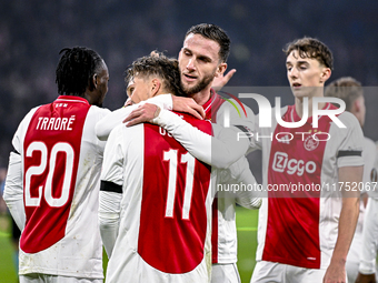 AFC Ajax Amsterdam forward Mika Godts and AFC Ajax Amsterdam midfielder Branco van den Boomen celebrate the 3-0 goal during the match betwee...