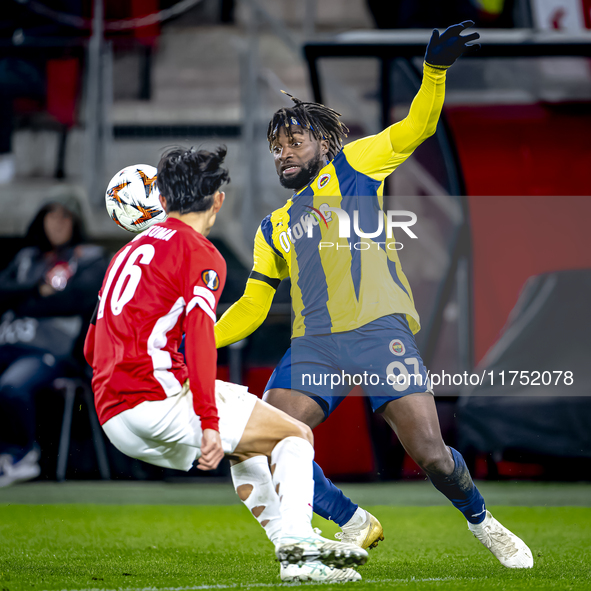 AZ Alkmaar defender Seiya Maikuma and Fenerbahce forward Allan Saint-Maximin play during the match between AZ and Fenerbahce at the AFAS Sta...