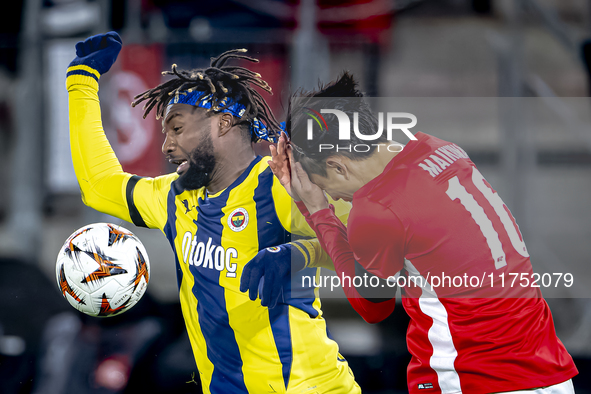 AZ Alkmaar defender Seiya Maikuma and Fenerbahce forward Allan Saint-Maximin play during the match between AZ and Fenerbahce at the AFAS Sta...