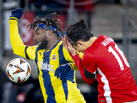 AZ Alkmaar defender Seiya Maikuma and Fenerbahce forward Allan Saint-Maximin play during the match between AZ and Fenerbahce at the AFAS Sta...