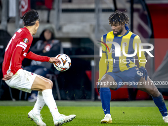 AZ Alkmaar defender Seiya Maikuma and Fenerbahce forward Allan Saint-Maximin play during the match between AZ and Fenerbahce at the AFAS Sta...