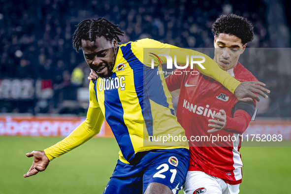 Fenerbahce forward Bright Osayi-Samuel and AZ Alkmaar defender Ro-Zangalo Daal play during the match AZ - Fenerbahce at the AFAS stadium for...