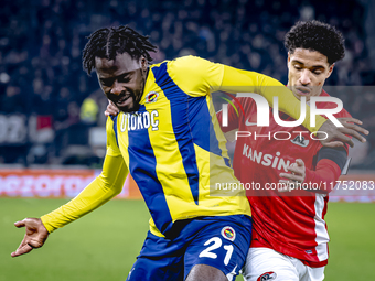 Fenerbahce forward Bright Osayi-Samuel and AZ Alkmaar defender Ro-Zangalo Daal play during the match AZ - Fenerbahce at the AFAS stadium for...