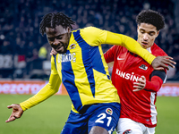 Fenerbahce forward Bright Osayi-Samuel and AZ Alkmaar defender Ro-Zangalo Daal play during the match AZ - Fenerbahce at the AFAS stadium for...