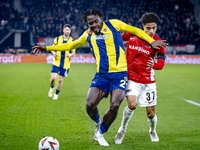 Fenerbahce forward Bright Osayi-Samuel and AZ Alkmaar defender Ro-Zangalo Daal play during the match AZ - Fenerbahce at the AFAS stadium for...