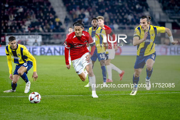 AZ Alkmaar defender Seiya Maikuma and Fenerbahce defender Caglar Soyuncu play during the match between AZ and Fenerbahce at the AFAS Stadium...