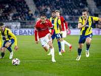 AZ Alkmaar defender Seiya Maikuma and Fenerbahce defender Caglar Soyuncu play during the match between AZ and Fenerbahce at the AFAS Stadium...