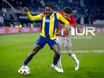 Fenerbahce forward Bright Osayi-Samuel and AZ Alkmaar defender Ro-Zangalo Daal play during the match AZ - Fenerbahce at the AFAS stadium for...