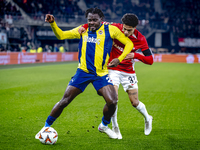 Fenerbahce forward Bright Osayi-Samuel and AZ Alkmaar defender Ro-Zangalo Daal play during the match AZ - Fenerbahce at the AFAS stadium for...