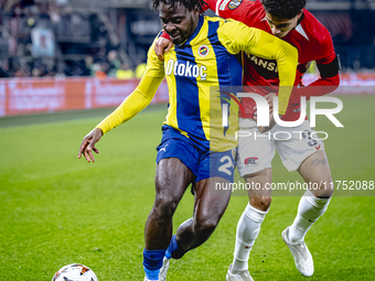 Fenerbahce forward Bright Osayi-Samuel and AZ Alkmaar defender Ro-Zangalo Daal play during the match AZ - Fenerbahce at the AFAS stadium for...