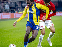 Fenerbahce forward Bright Osayi-Samuel and AZ Alkmaar defender Ro-Zangalo Daal play during the match AZ - Fenerbahce at the AFAS stadium for...