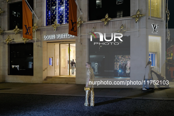 A woman poses for a photograph in Mayfair, London, on November 7, 2024. 