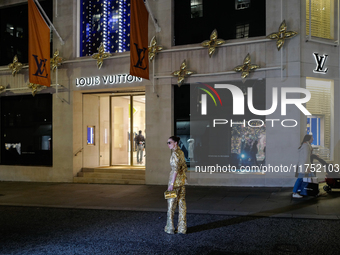 A woman poses for a photograph in Mayfair, London, on November 7, 2024. (