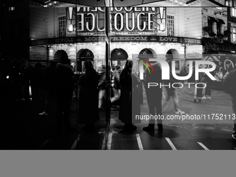 The Piccadilly Theatre reflects in a glass window in London, England, on November 7, 2024. (