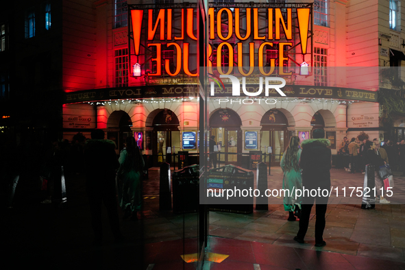 The Piccadilly Theatre reflects in a glass window in London, England, on November 7, 2024. 