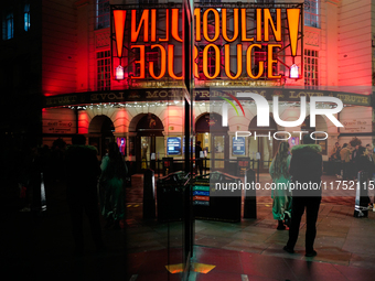 The Piccadilly Theatre reflects in a glass window in London, England, on November 7, 2024. (