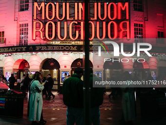 The Piccadilly Theatre reflects in a glass window in London, England, on November 7, 2024. (