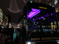 A passenger sits on a coach as it drives on Regent Street in London, England, on November 7, 2024. (