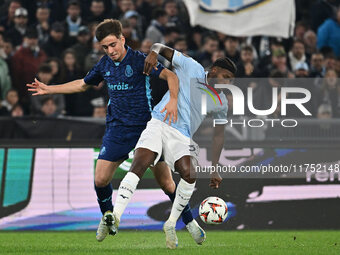 Martim Fernandes of F.C. Porto and Nuno Tavares of S.S. Lazio are in action during the UEFA Europa League 2024/25 League Phase MD4 match bet...